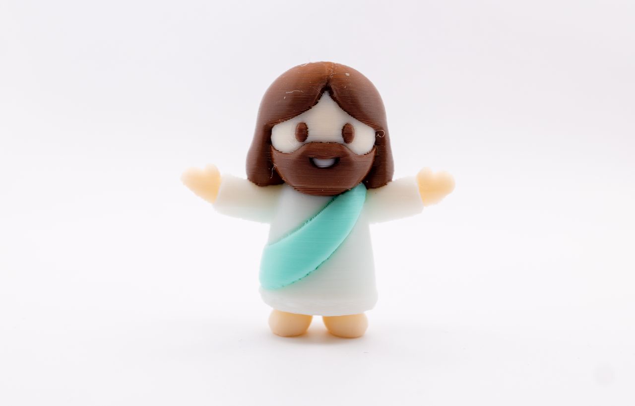 Home Adorable 3D printed toy figure with a charming expression and cartoon style design.